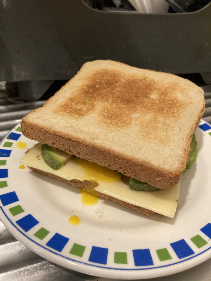 Breakfast—Steps to make soft-boiled egg, avocado and ham sandwich: 6
